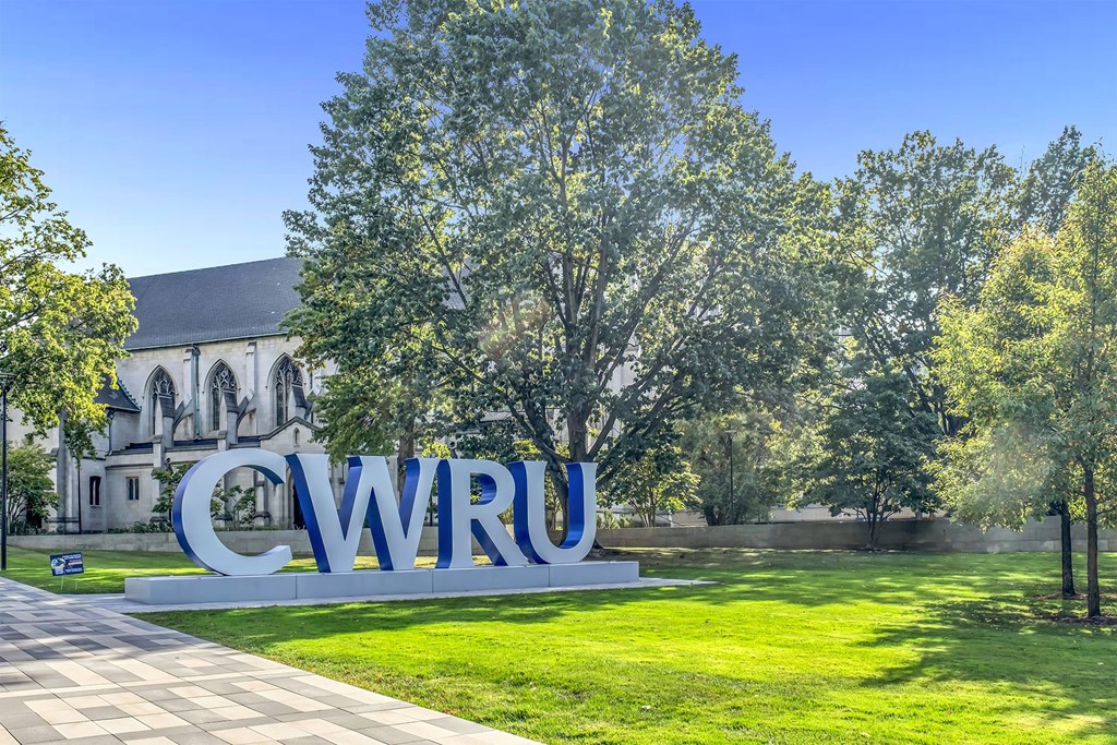 A large CWRU sign is in front of a building.