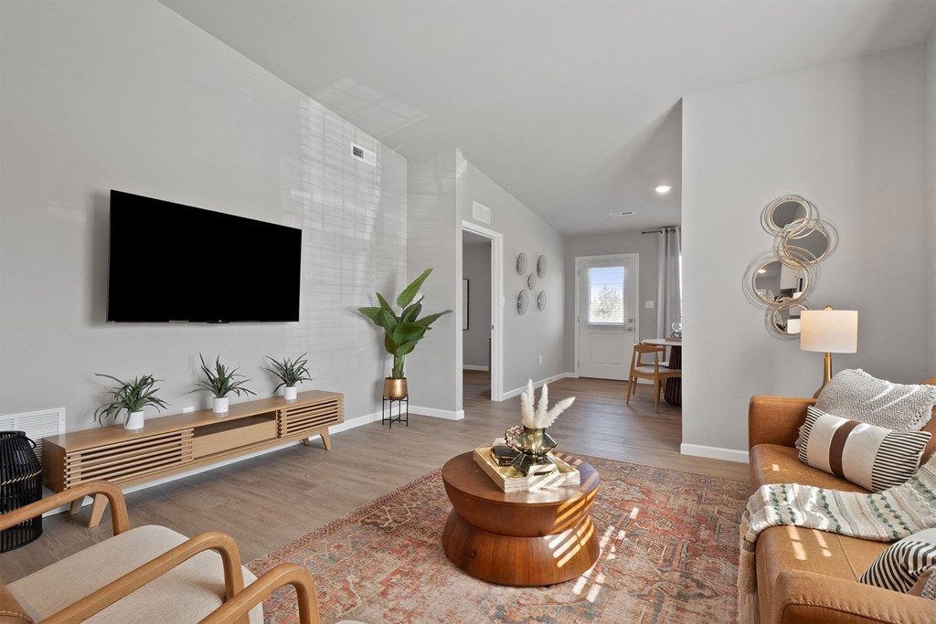 a living room with a couch and a tv