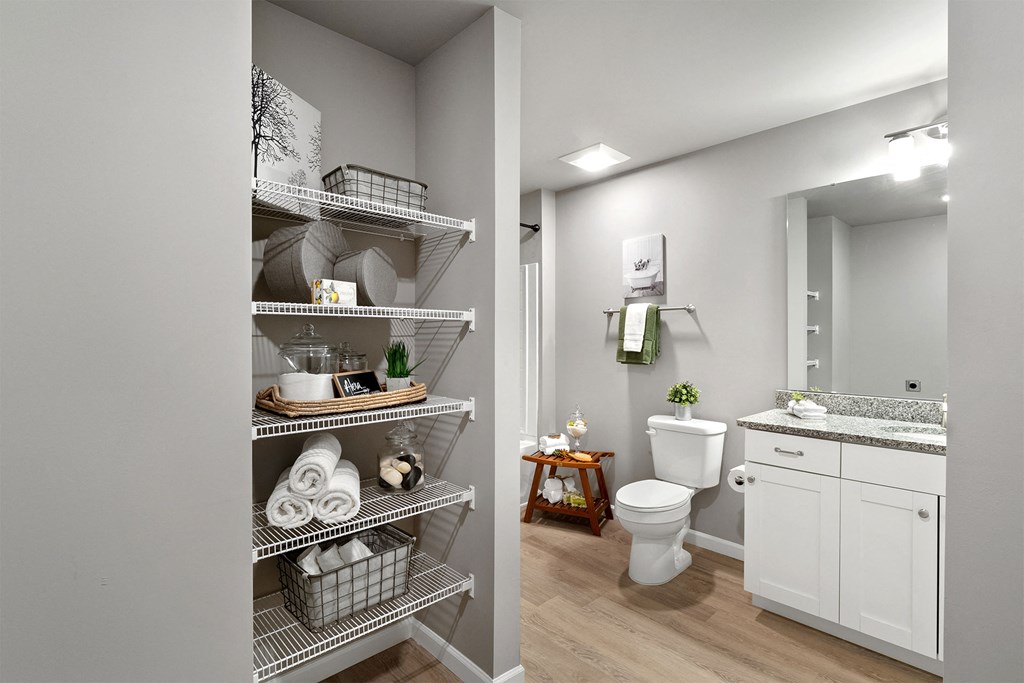 a bathroom with a shower and a toilet and a sink