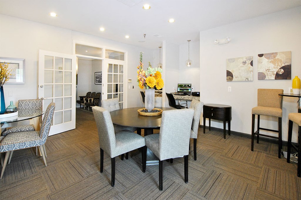 a dining room with a table and chairs
