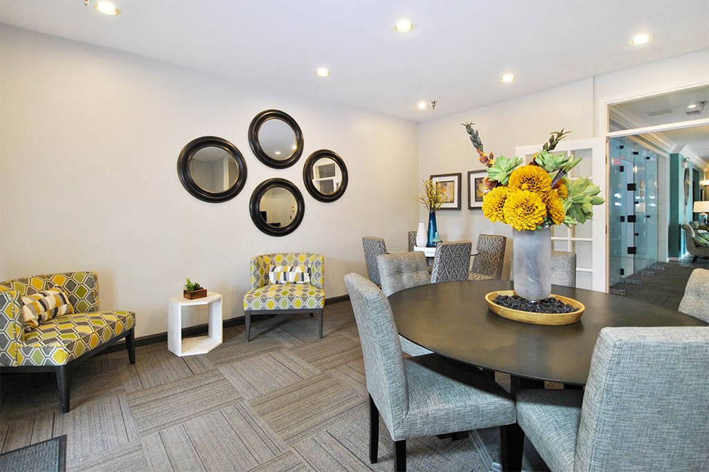 a dining room with a table and chairs