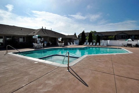 A pool with a ladder in the middle of it.