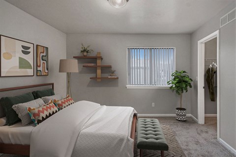 a bedroom with a large bed and a window