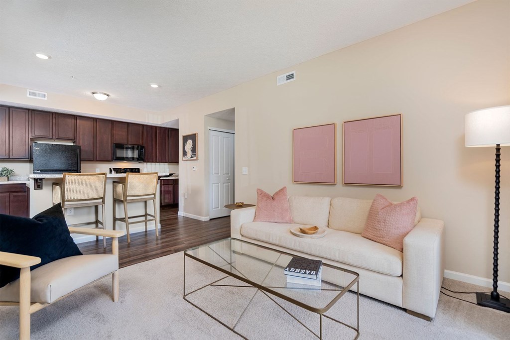a living room with a couch and a glass table