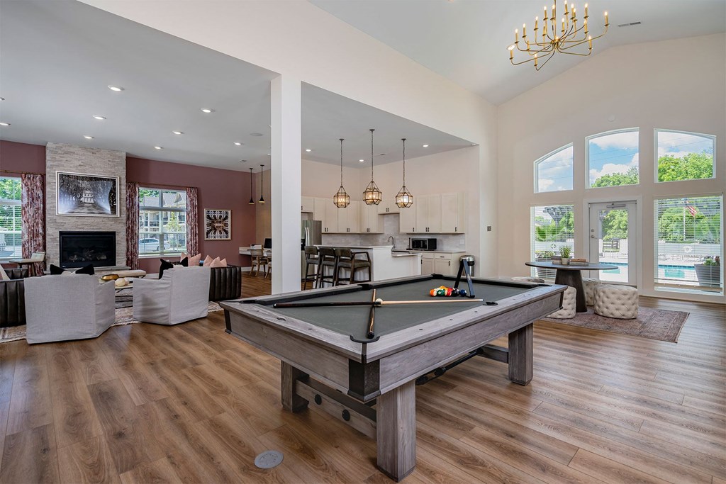 a pool table in the middle of a living room