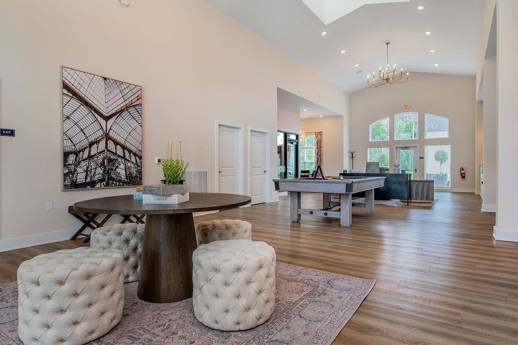 a game room with a ping pong table and a pool table