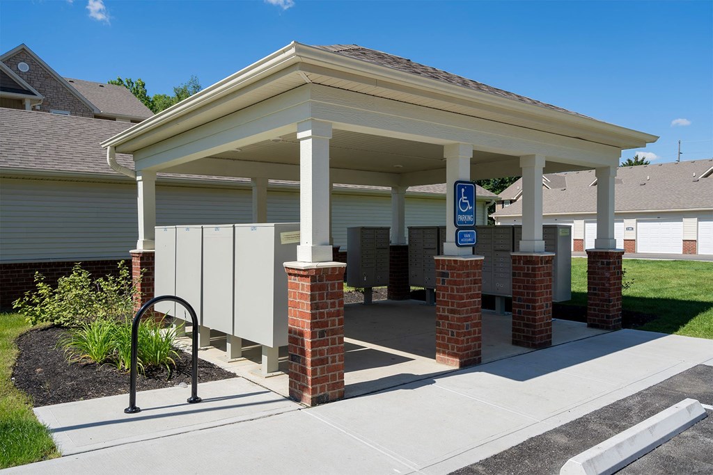 a covered parking lot in front of a building