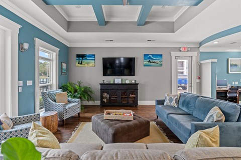 A living room with a fireplace and a television.