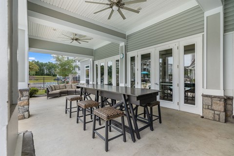 A patio with a table and chairs is shown.