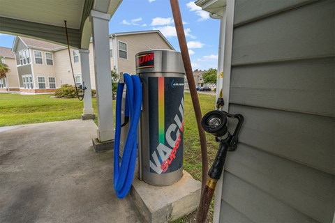 A gas pump with a hose attached to it.
