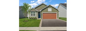 A house with a garage door and a driveway.