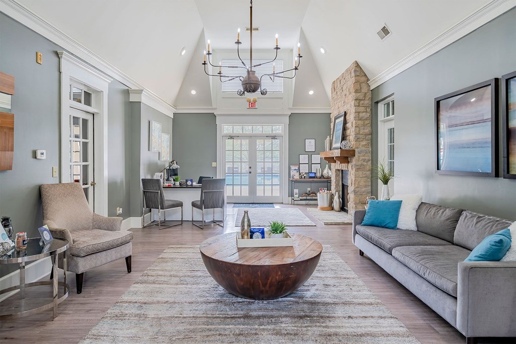 a living room with a coffee table in the middle of the room