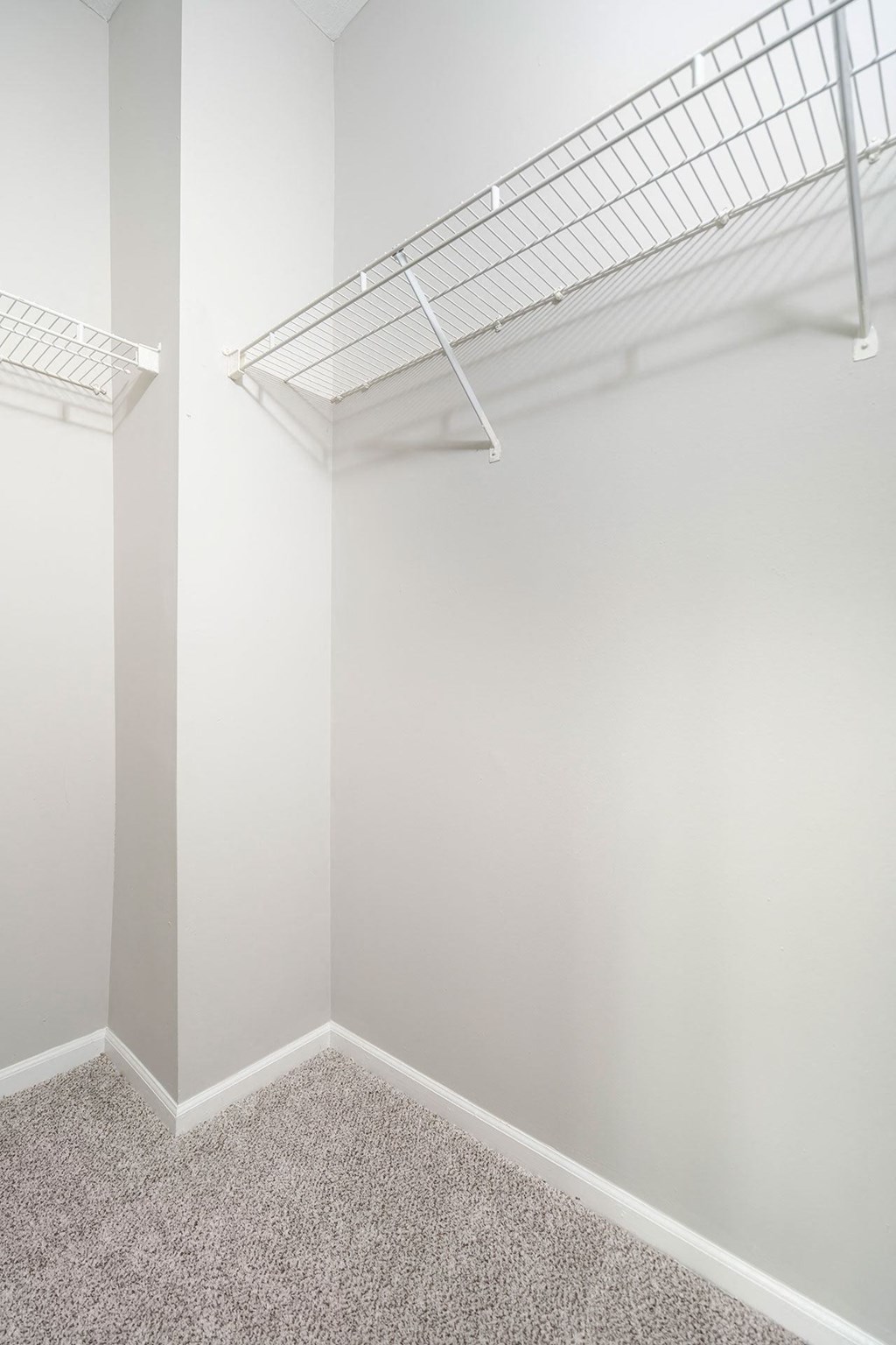 a walk in closet in a 555 waverly unit