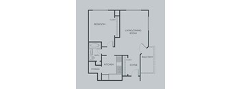 A floor plan of a home with a bedroom, living/dining room, kitchen, and foyer.