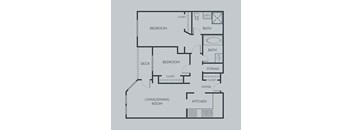 A floor plan of an apartment with a living/dining room, kitchen, two bedrooms, a bath, storage, and a foyer.