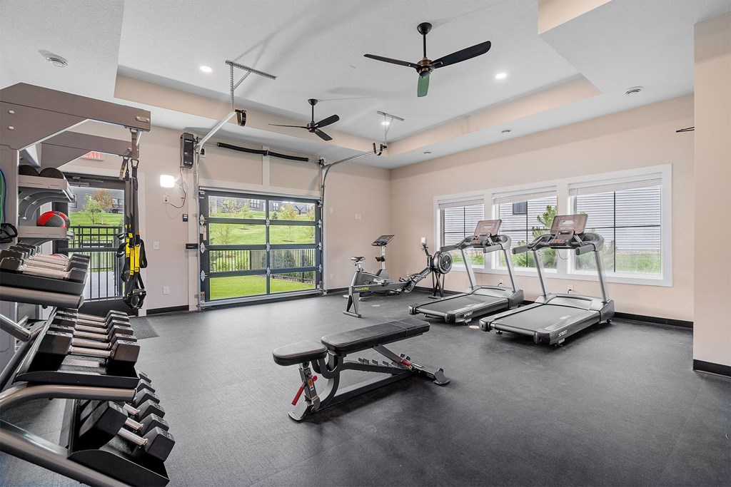 a gym with treadmills and other exercise equipment