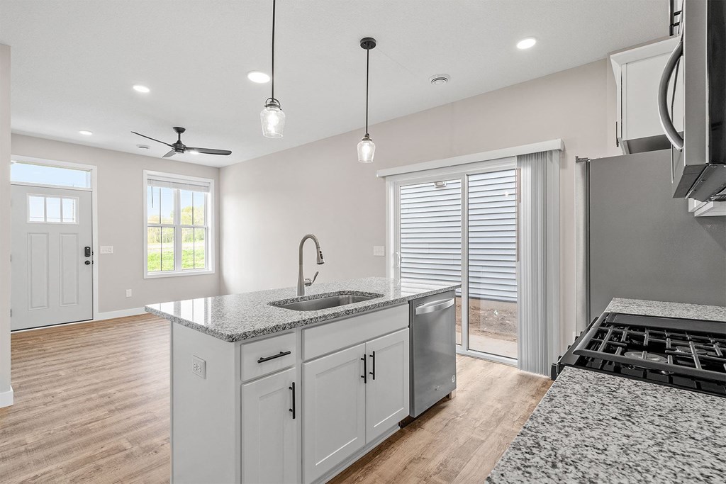 a kitchen with a sink and a stove