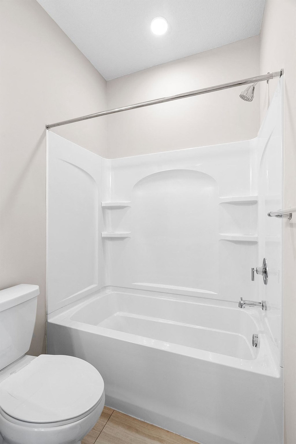 a bathroom with a toilet and a bathtub