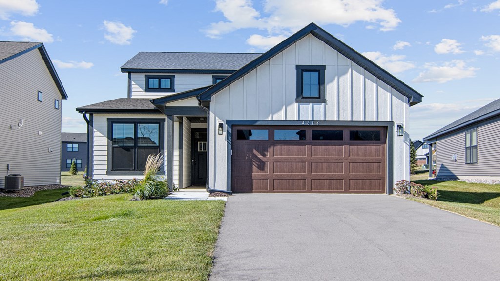 a house with a brown garage door