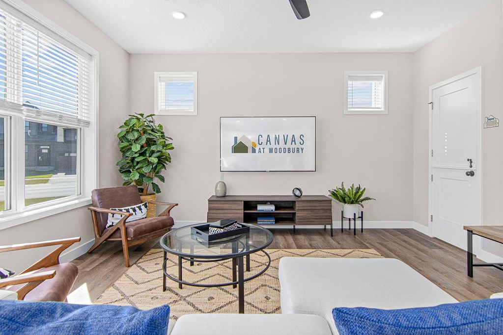 a living room with a couch chair and coffee table