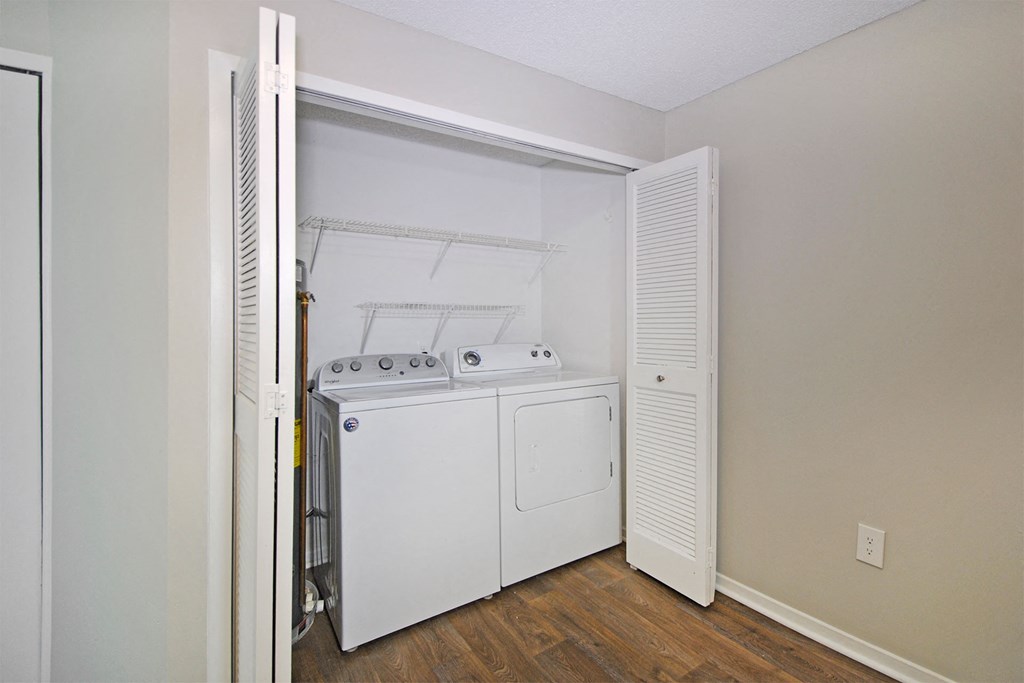 laundry closet with a washer and dryer in it