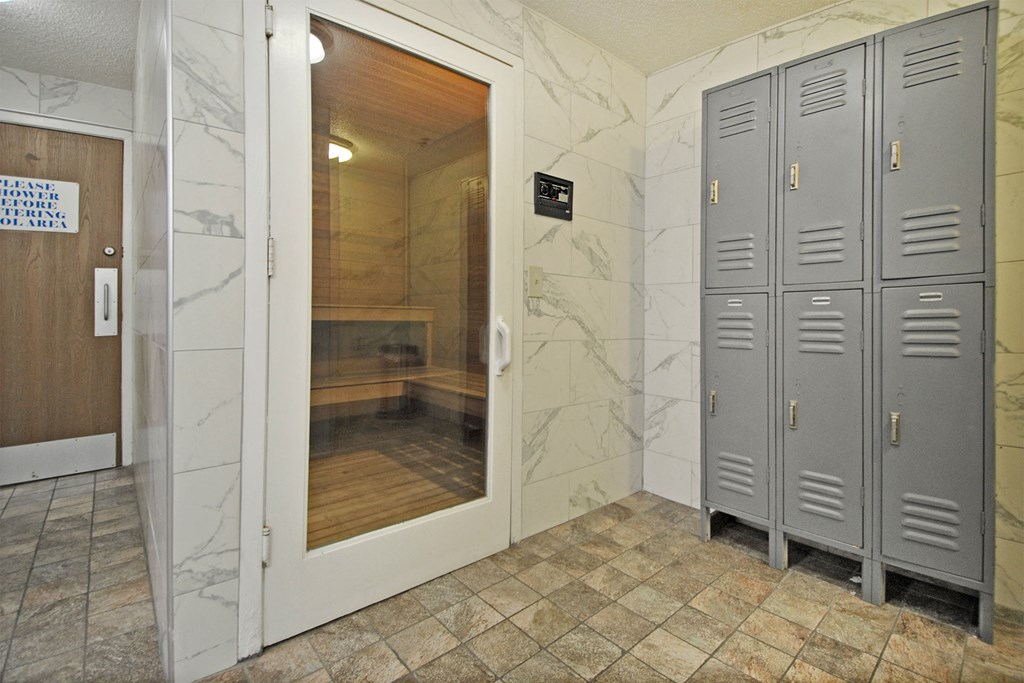 the locker room is equipped with lockers and a shower