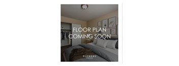 A bedroom with a bed, pillows, and a wall with pictures and a sign that says "FLOOR PLAN COMING SOON".