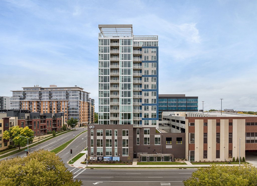 a view of a tall building from a city street