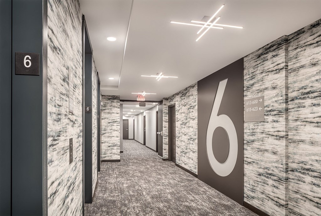 a hallway with a large number on the wall in a office