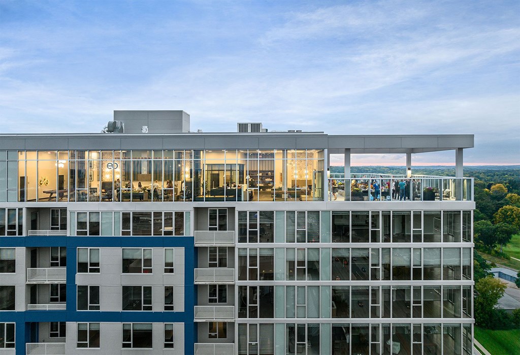 a large building with people on the top of it