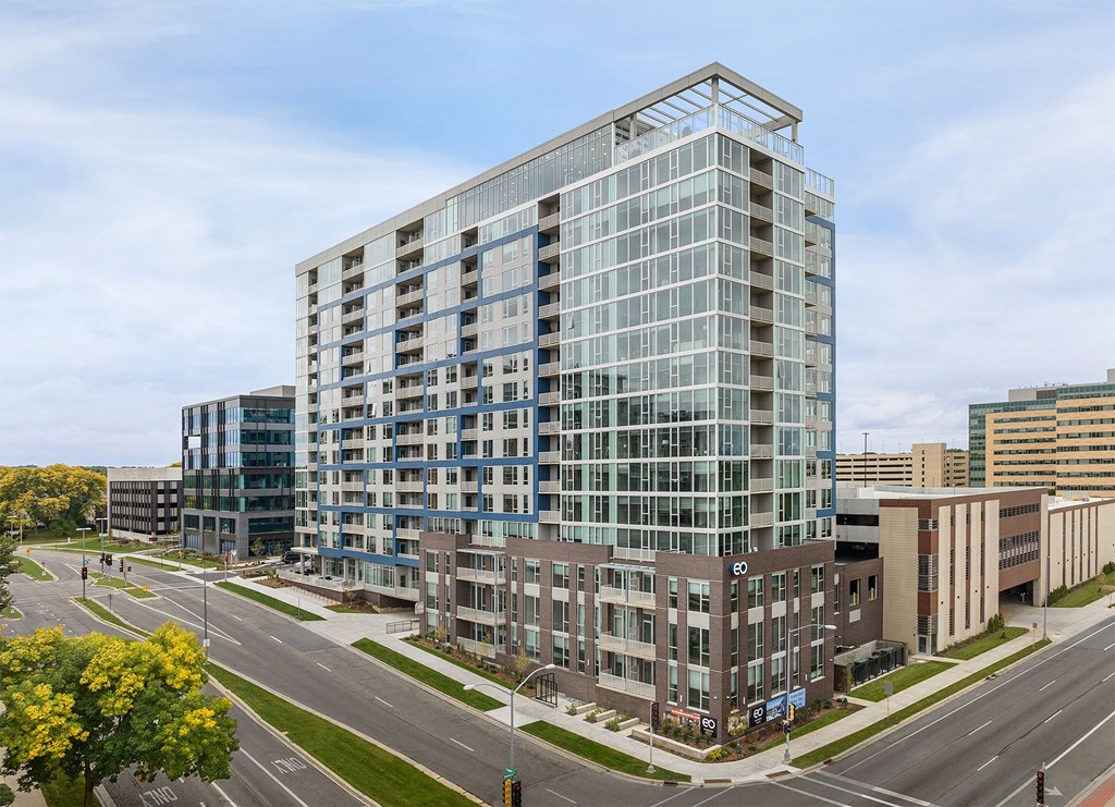 an aerial view of a tall building in a city