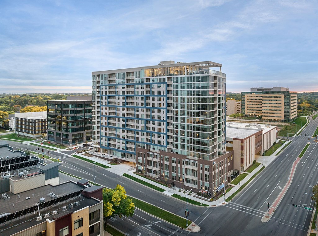 an aerial view of a tall building in a city