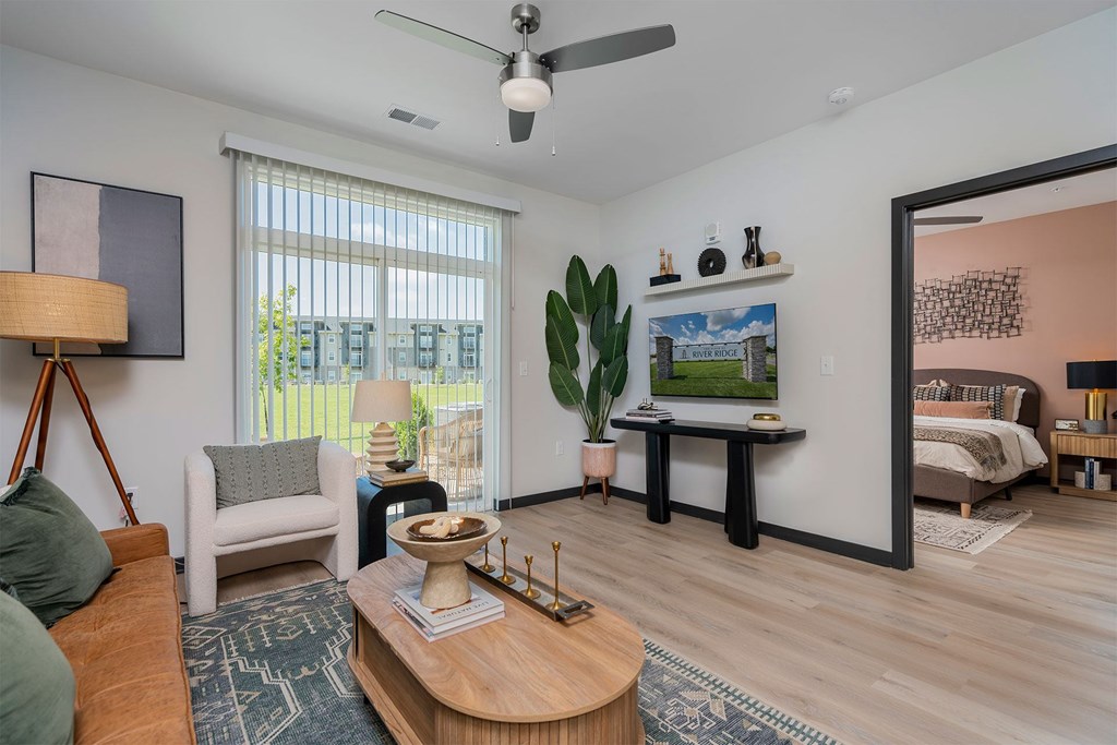A living room with a couch, chair, and a coffee table.