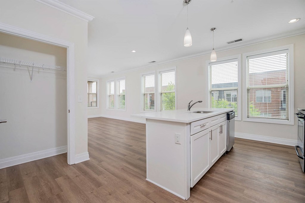 a kitchen and dining area in a 555 waverly unit