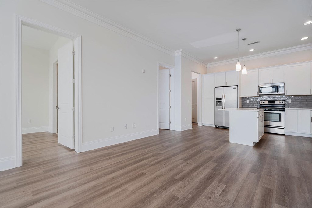 a kitchen and living room in a 555 waverly unit