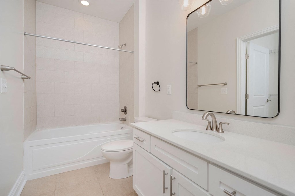 a bathroom with a sink toilet and bathtub