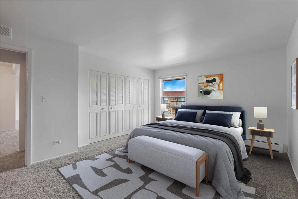 a bedroom with a large bed in a room