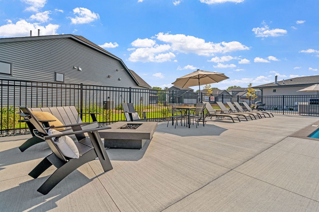 our apartments have a large patio with tables and chairs