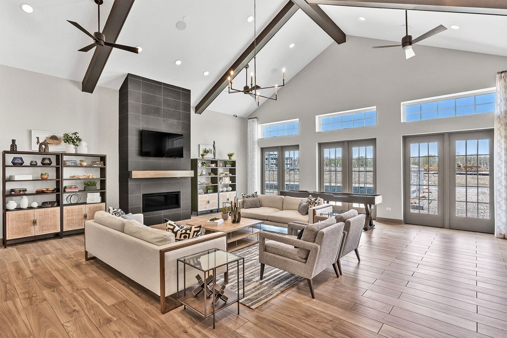a living room with couches and chairs and a fireplace