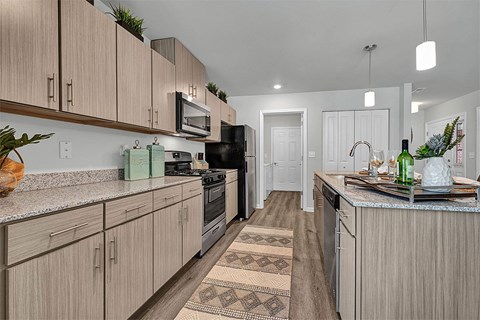 a kitchen with wooden cabinets and a counter top