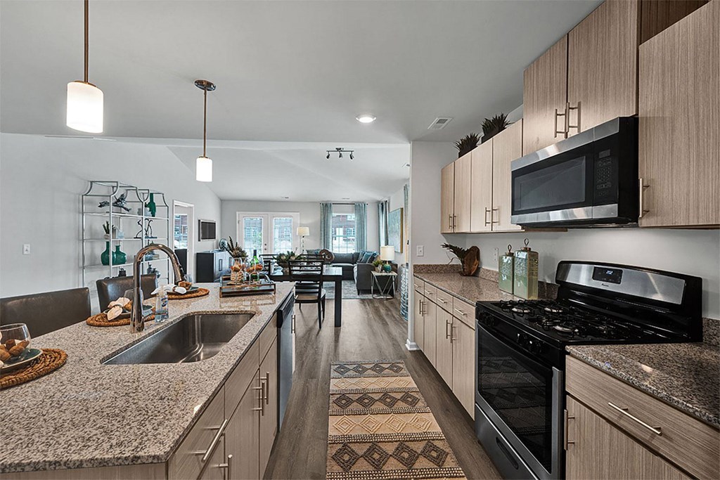 a kitchen with granite counter tops and a sink