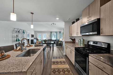 a kitchen with granite counter tops and a sink