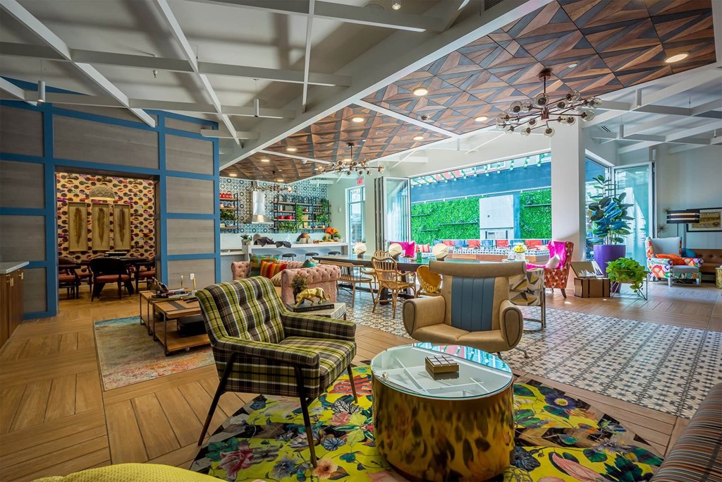 A living room with a leopard print coffee table in the center.