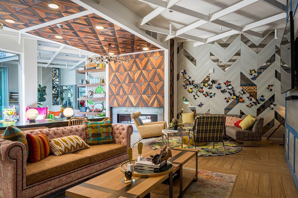 A living room with a brown sofa and a wooden coffee table.