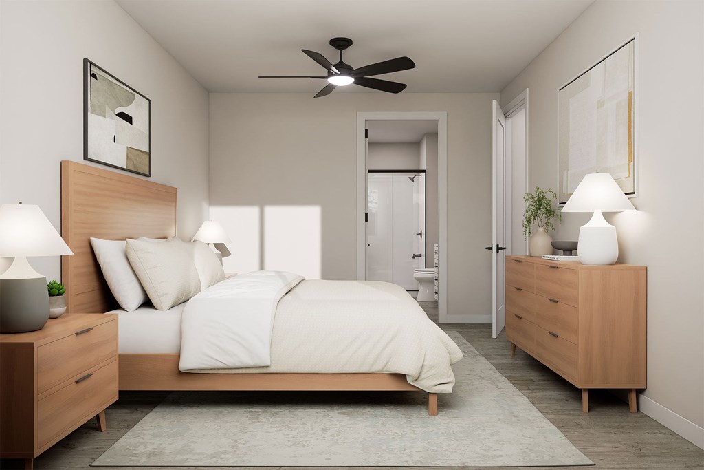 A bedroom with a bed, two nightstands, and a ceiling fan.