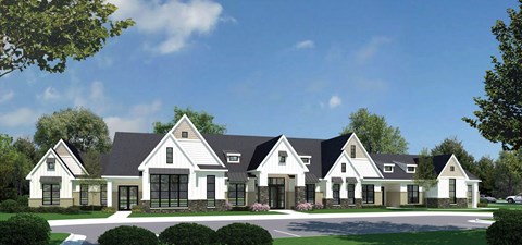A large, modern house with a black roof and white walls.