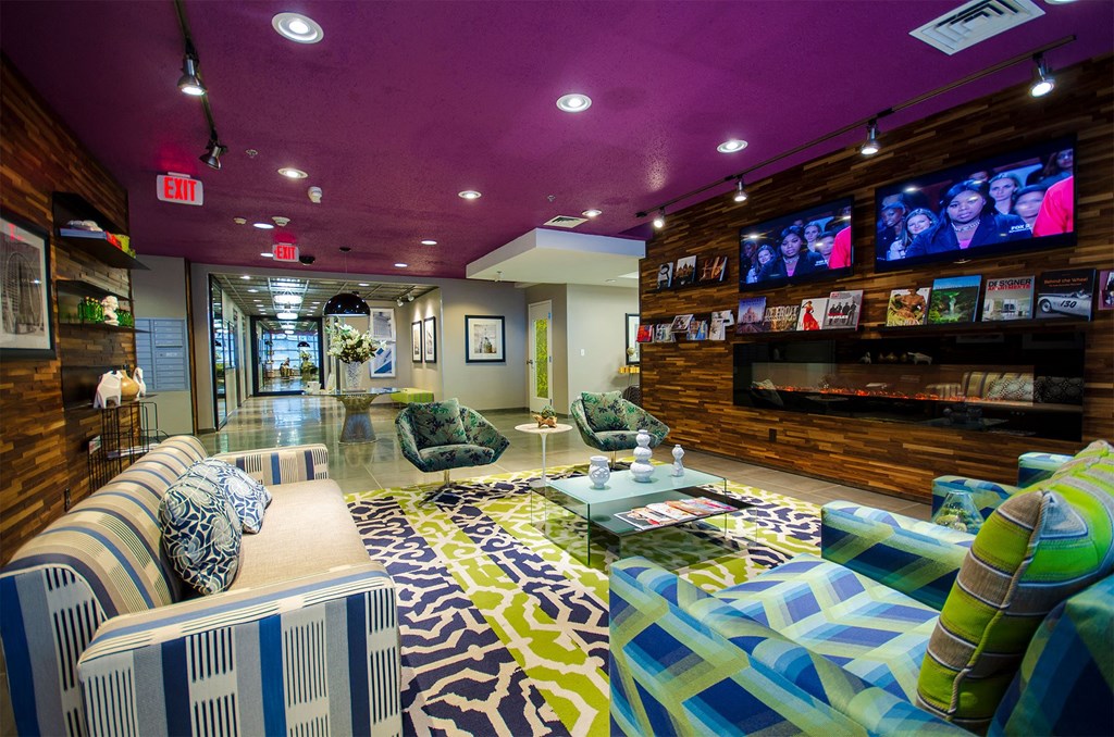 a living room with couches and a tv