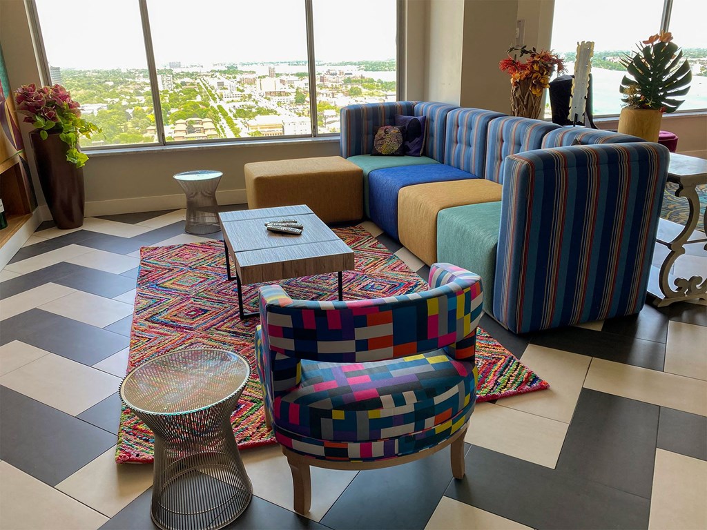 a living room with couches and chairs and a table