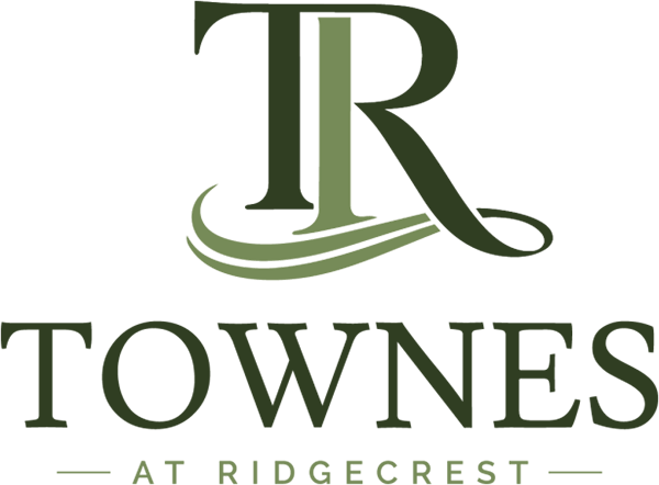 A logo with the letters "TR" and the word "TOWNS" below it.