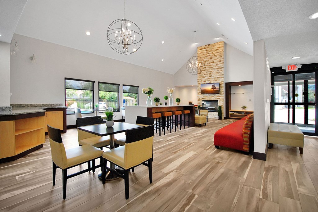 a dining room and living room with a table and chairs